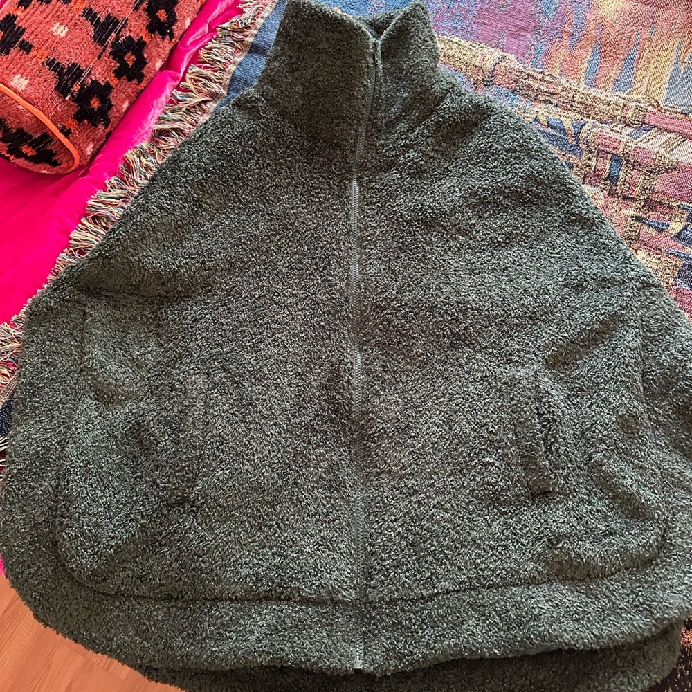 Dudley Stephen’s green fuzzy poncho